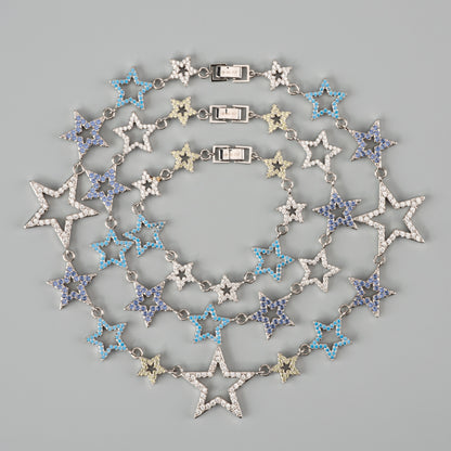 Star-shaped necklace with blue gems on a gray background