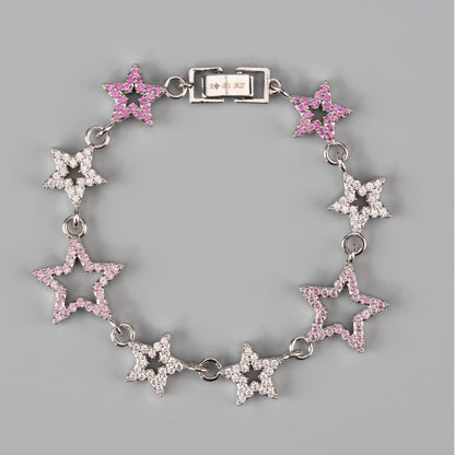 Star-shaped bracelet and matching collar  with pink and clear stones on a gray background