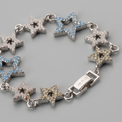 Silver bracelet and luxury collar with star-shaped luxury collar on a gray background